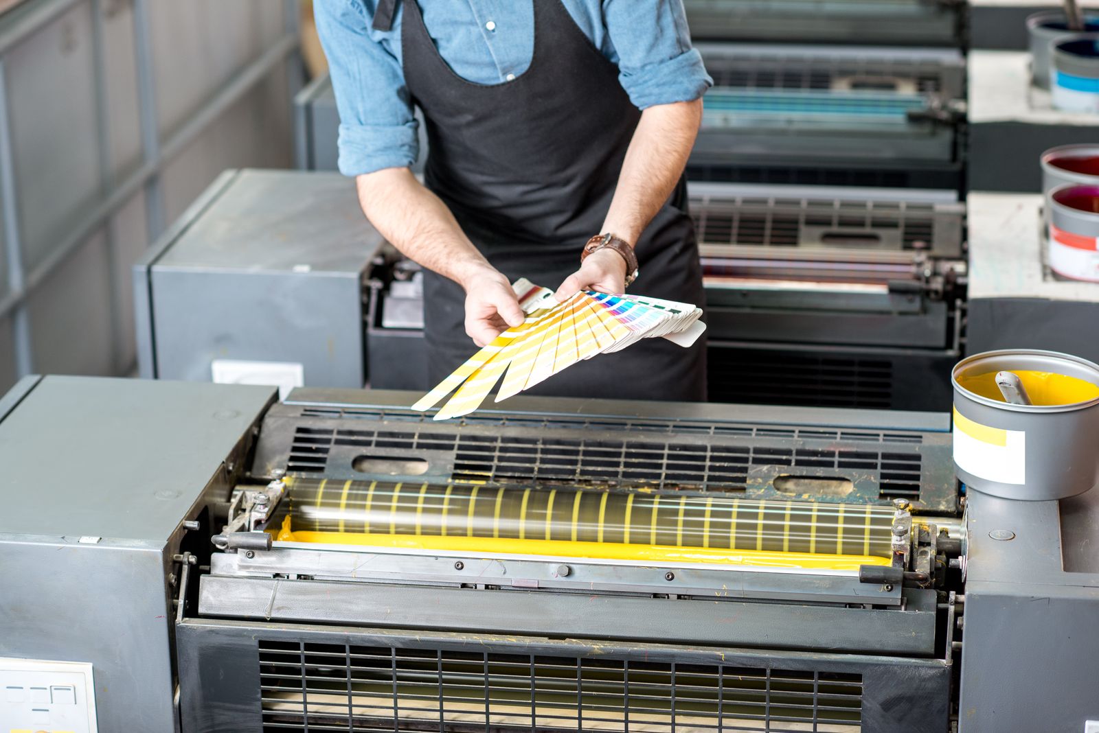 Pantone printing machine with selected colour in production.